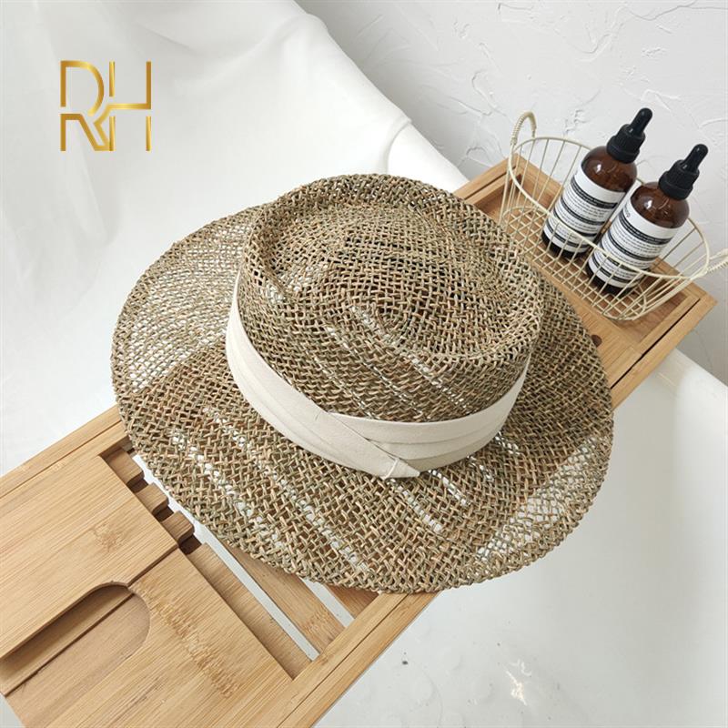 Travel Natural seagrass hollow flat brim hat ladies summer porkpie concave round sun hat beach straw hat with ribbon sale