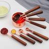 Gold-Plated Stainless Steel Measuring Cups & Spoons with Solid Wood Handles and Scale Markings for Baking.