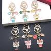 Six-Color Oil Drip Cartoon Chinese Style Keychain: Four-Leaf Clover, Cherry Blossom, Lion Pendant for Backpack