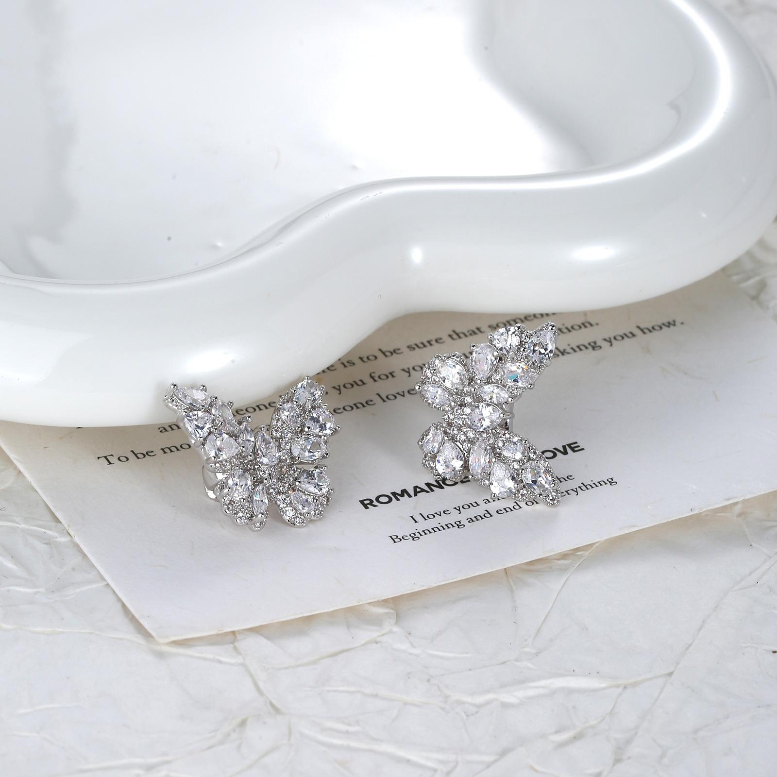 KAVNAR Luxury Earbud Charms Pavé Butterfly Platinum Plated Cubic Zirconia Detachable Anti-Lost Clips