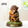 Decorative Monkey Statue Cute Figurine Small Baby Holding Plush Toy Animal Table Centerpiece Desktop Ornament for Living Room Bedroom Office