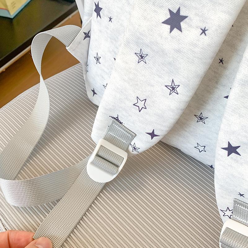Star-Printed Backpack with Front Zipper Pocket and Tassel Details for School and Daily Use