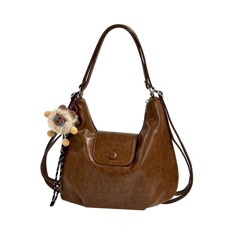 

2025 spring new niche design retro fashion tote bag women s Korean version commuting large-capacity shoulder bag no pendant коричневый
