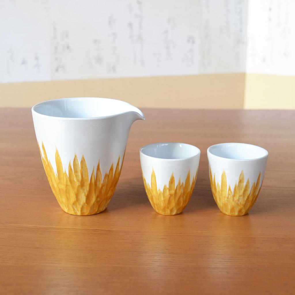 A stylish Arita ware sake set featuring one sake bottle and two sake perfect for retirement This set includes one sake bottle and two sake crafted by