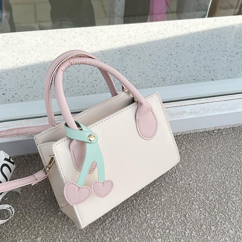 

Foreign style small bag women s 2024 spring and summer new fashion shoulder messenger bag simple texture casual portable small square bag рожевий