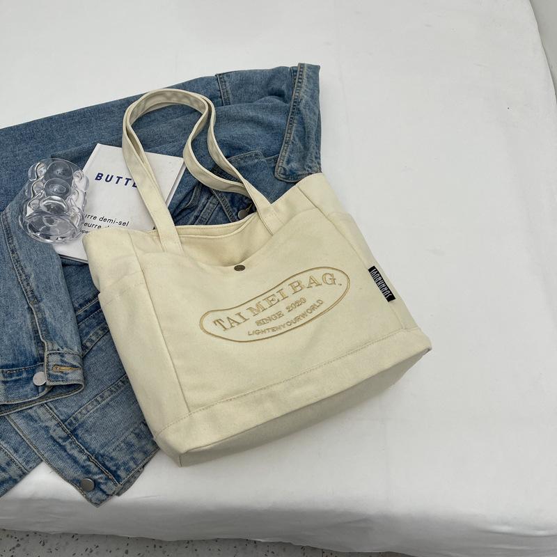 

2025 Жіноча велика повсякденна полотняна сумка-тоут - Універсальна, стильна та підходить для поїздок на роботу або на навчання брудно-білий