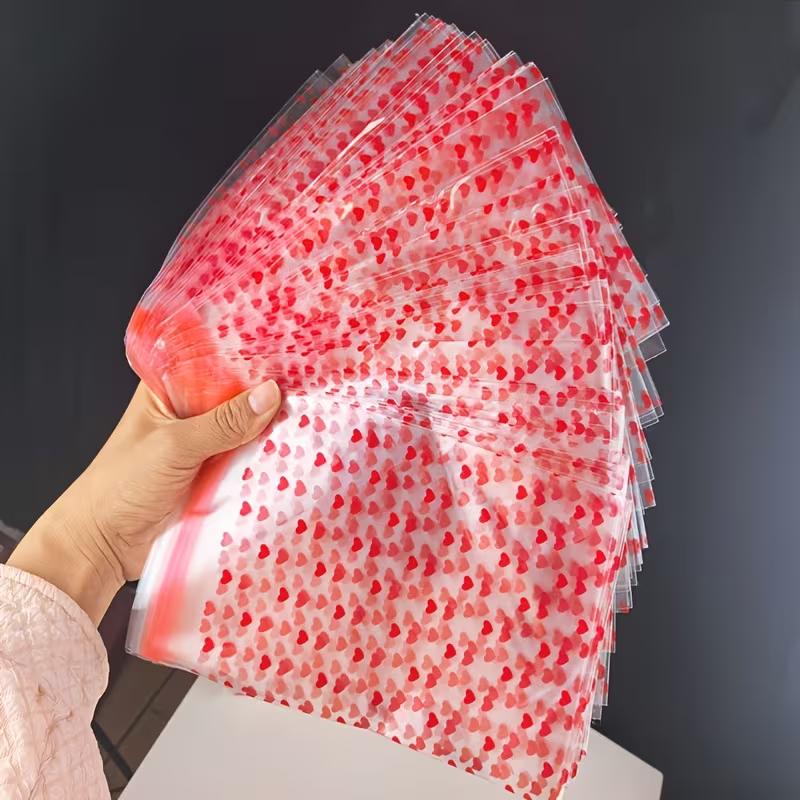 WTEMPO Valentinstag Hochzeit Geschenkbeutel Herzförmiges Muster Aufgedruckt Klare Selbstversiegelnde Beutel Tragbare Wiederverwendbare Plastiktüten Universelle Verpackungsbeutel