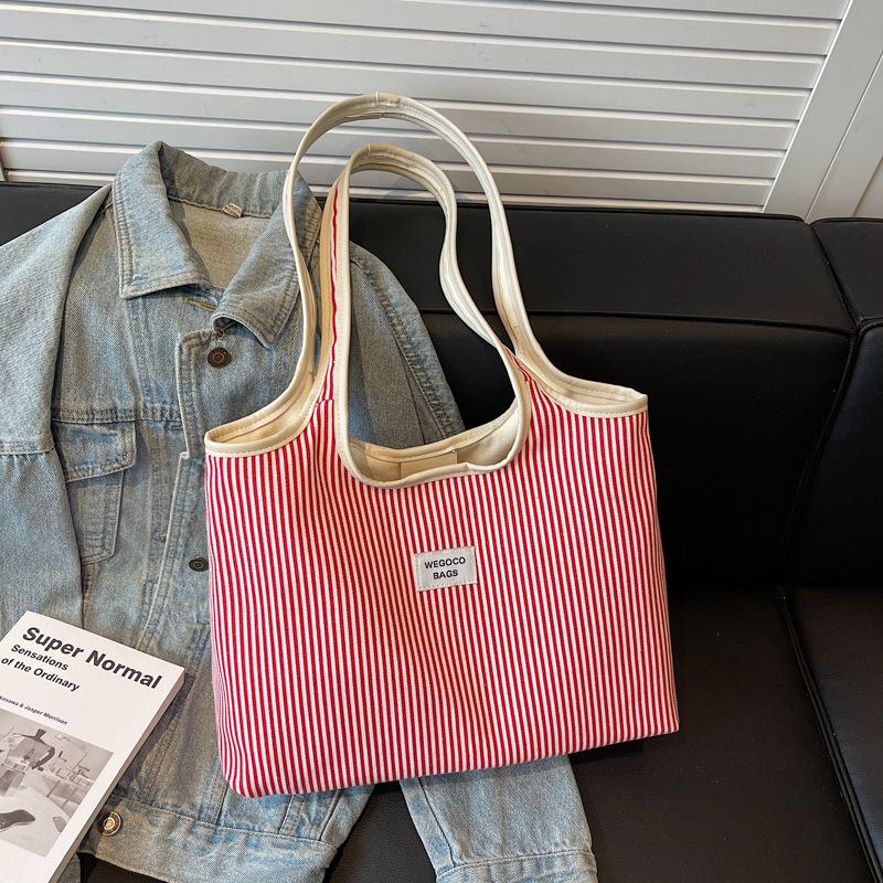 

Literary and leisure large-capacity niche summer new leisure personality simple trend tote bag бордовий