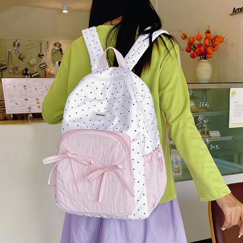 The new schoolbag is high-value, fresh and sweet, candy-colored polka dot bow backpack, junior high school backpack.