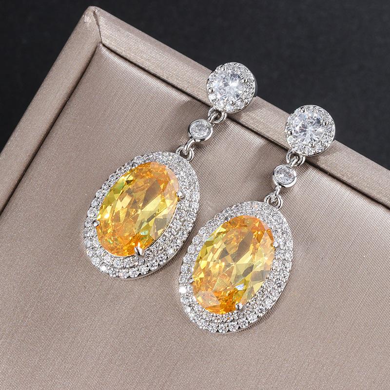 

Ювелирные изделия Цвет Сокровище Популярный Имитация Желтого Бриллианта 8 * 12 Денье Серьги Подвески Уши