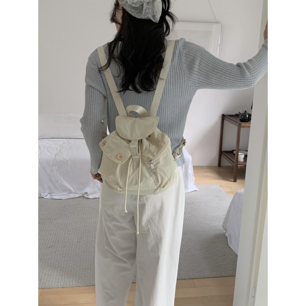 IELGY new Korean niche design outdoor pocket button drawstring double shoulder nylon backpack
