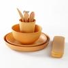 16-Piece Wheat Straw Dinnerware Set: Includes Plates, Rice Bowls, Cups, Spoons, and Forks.