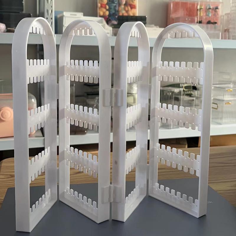 

Стойка для демонстрации серег Прозрачная многослойная Гладкий край Большая вместимость Высокая устойчивость Экономия места Пластиковый настольный ювелирный стенд белый