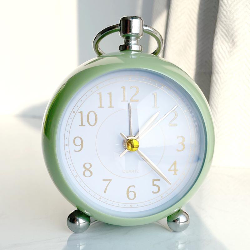 Silent Metal Alarm Clock with Night Light and Gold Stamped Spherical Face - Perfect for Students and Children.