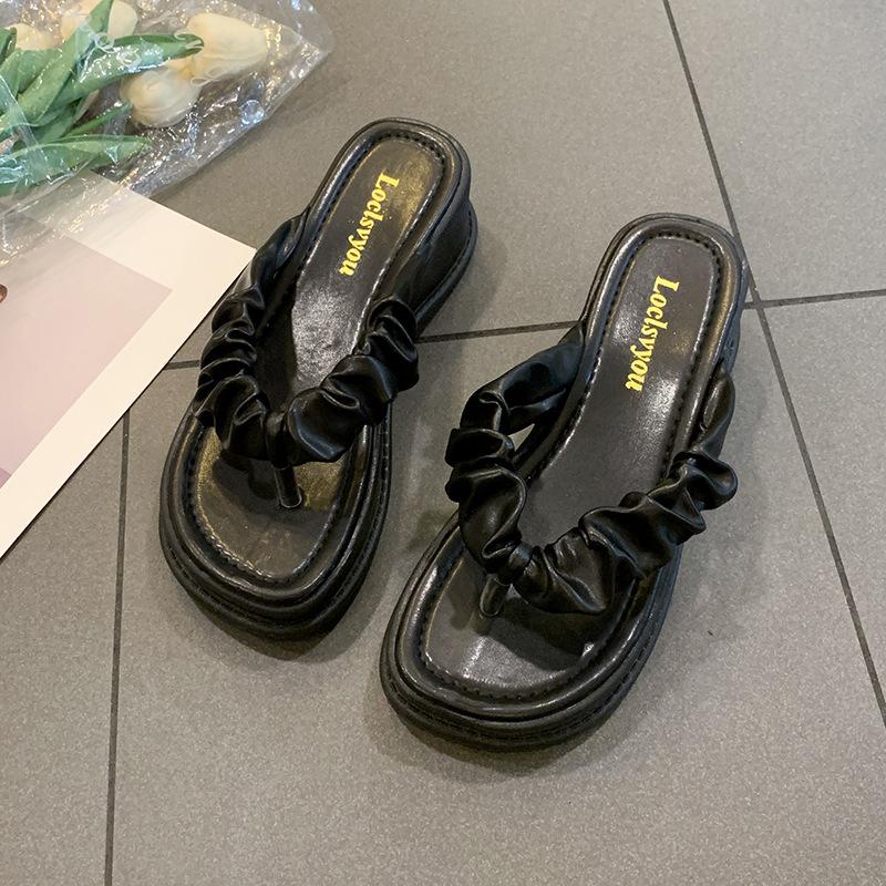

Slope heel girl 2025 summer Internet celebrity fairy wind flip-flops thick bottom Korean version of super high heel wear cool slippers 40 чорний