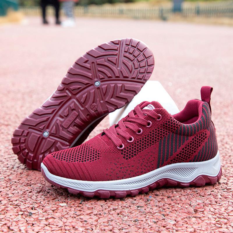 Neue Frühjahrs- und Herbst-Flugweberei Herren- und Damen-Paar-Sportschuhe modische vielseitige Laufschuhe Netz atmungsaktive lässige Wanderschuhe