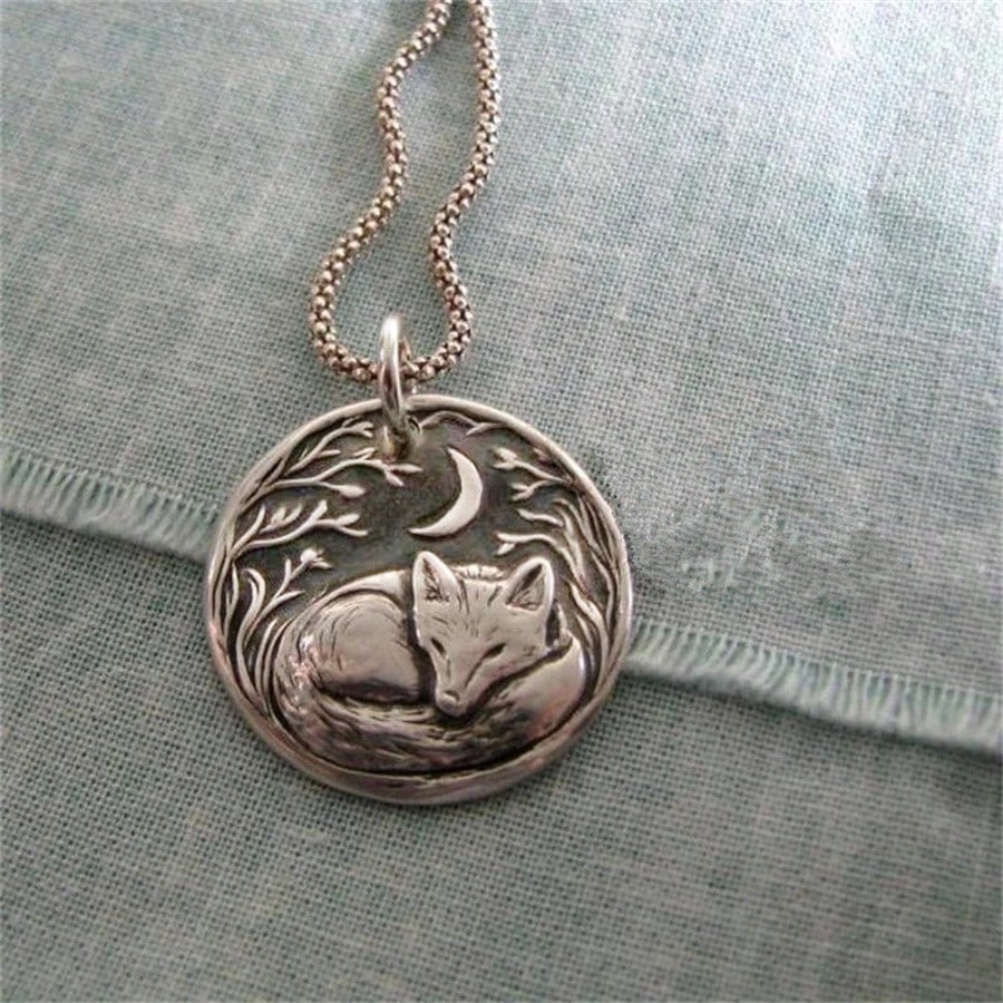 

A vintage forest and moon design with a sleeping fox round pendant necklace, a stylish and unique women s jewelry accessory.
