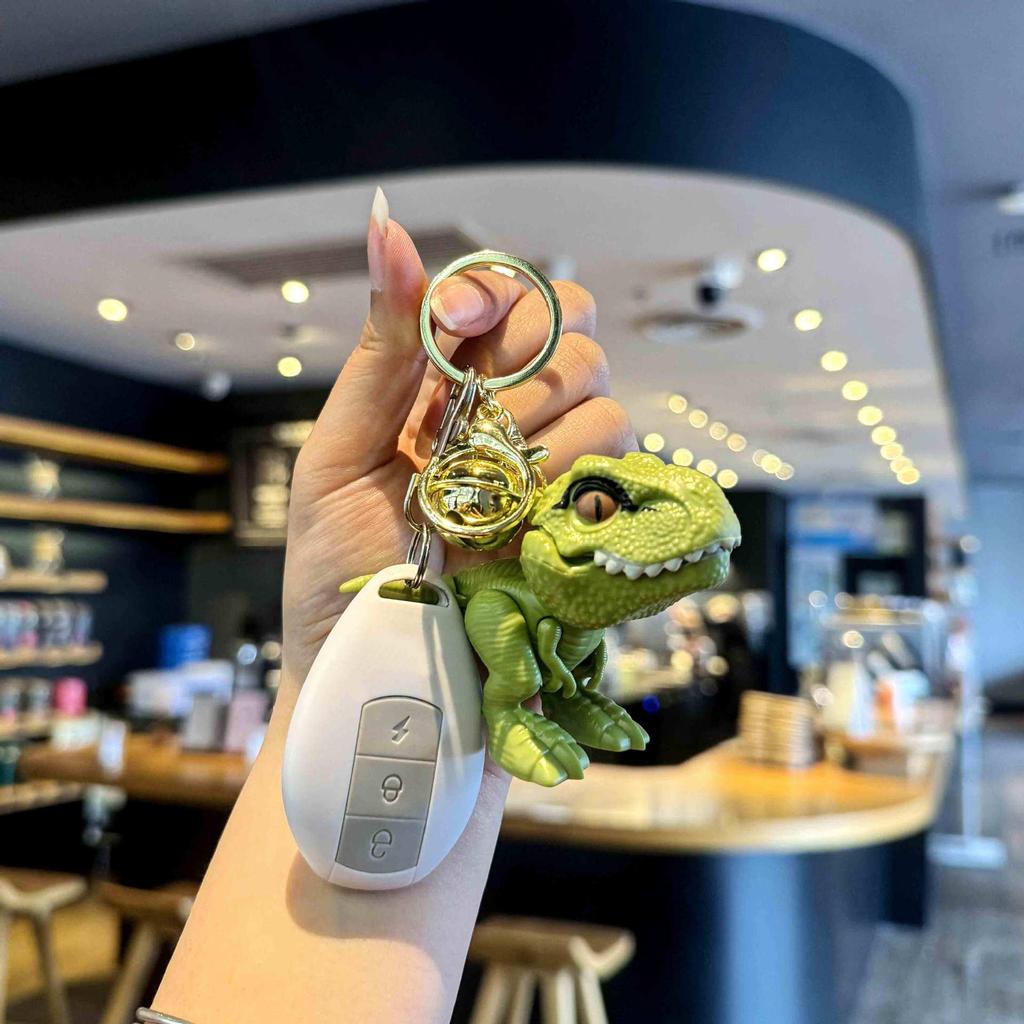 Trendy PVC Cartoon T-Rex Keychain Pendant with Dinosaur Bell and Hand-Biting Feature