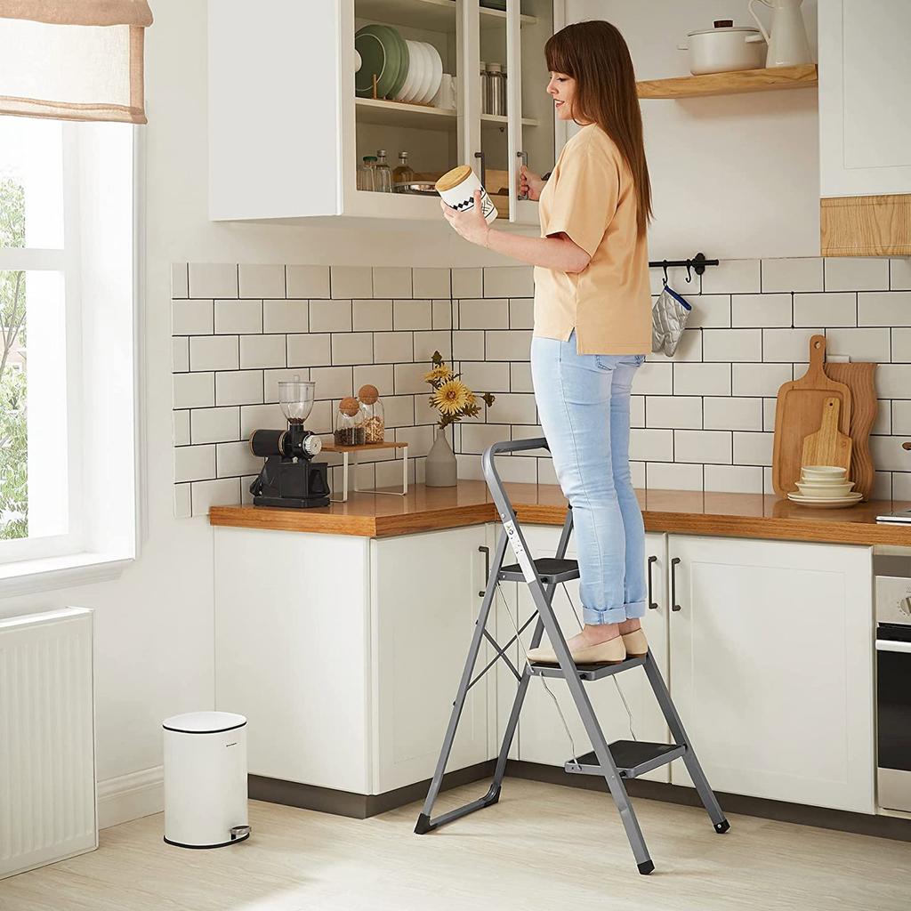 SONGMICS 3-Step Ladder, Folding Ladder, 20 cm Wide Steps Covered with Non-Slip Rubber, Rubber Feet, Handrail, Max. Static Load 150 kg, Steel