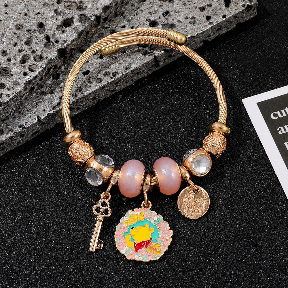 Winnie Puuh Handkette für Damen und Teenager mit goldenen Zinklegierungsperlen und Cartoon-Design
