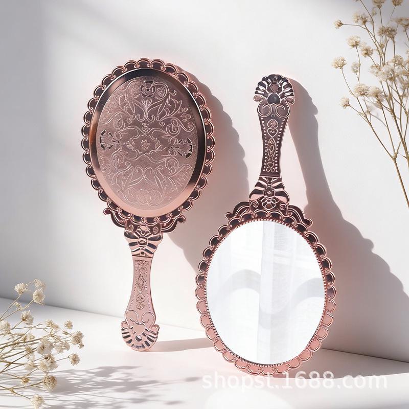 

Rose Gold Handheld & Desktop Vanity Mirror with Patterned Design 10.5cm*24.6cm Electroplated Patterned Mirror