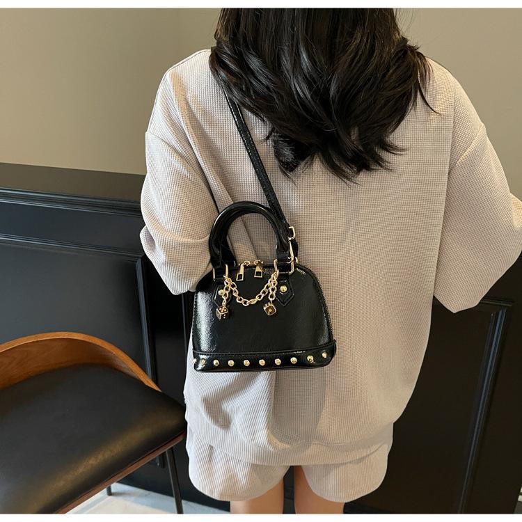 Popular portable shell small bag women's 2025 new high-end rivet saddle bag fashionable shoulder messenger bag