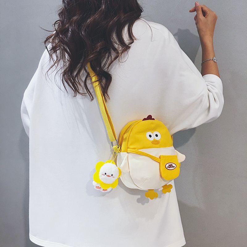 

Милая мини-холщовая сумка женская 2025 Осень Новое поступление Повседневный нишевый стиль Сумка для мобильного телефона Детская мультяшная сумка-мессенджер White with yellow [bare bag]]
