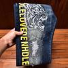 Men's Slim-Fit Embroidered Floral Distressed Jeans with Patches and Elastic Trim.