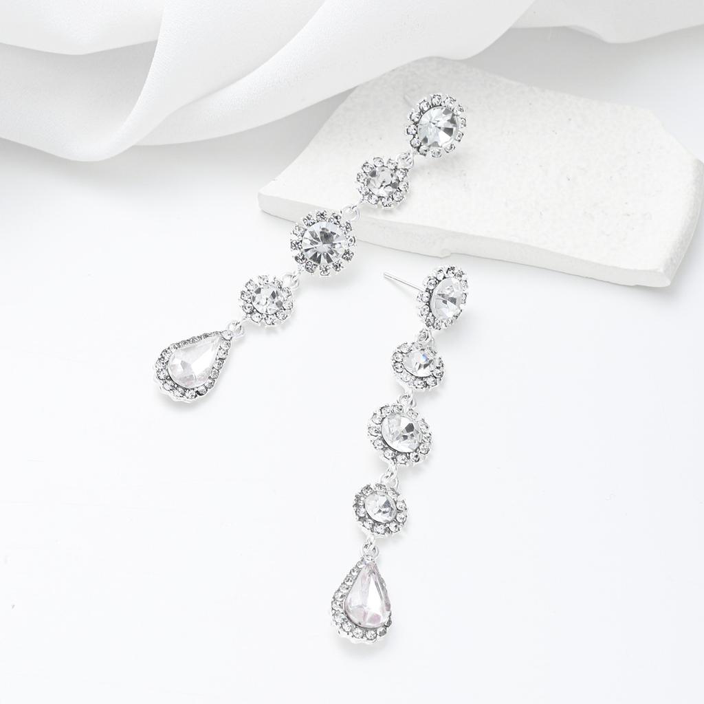 Neue amerikanische Retro-Ohrringe vielseitige lange Ohrringe mit Fransen besetzt mit weißem Kristall Wassertropfen Ohrstecker weiblich Ins vielseitig