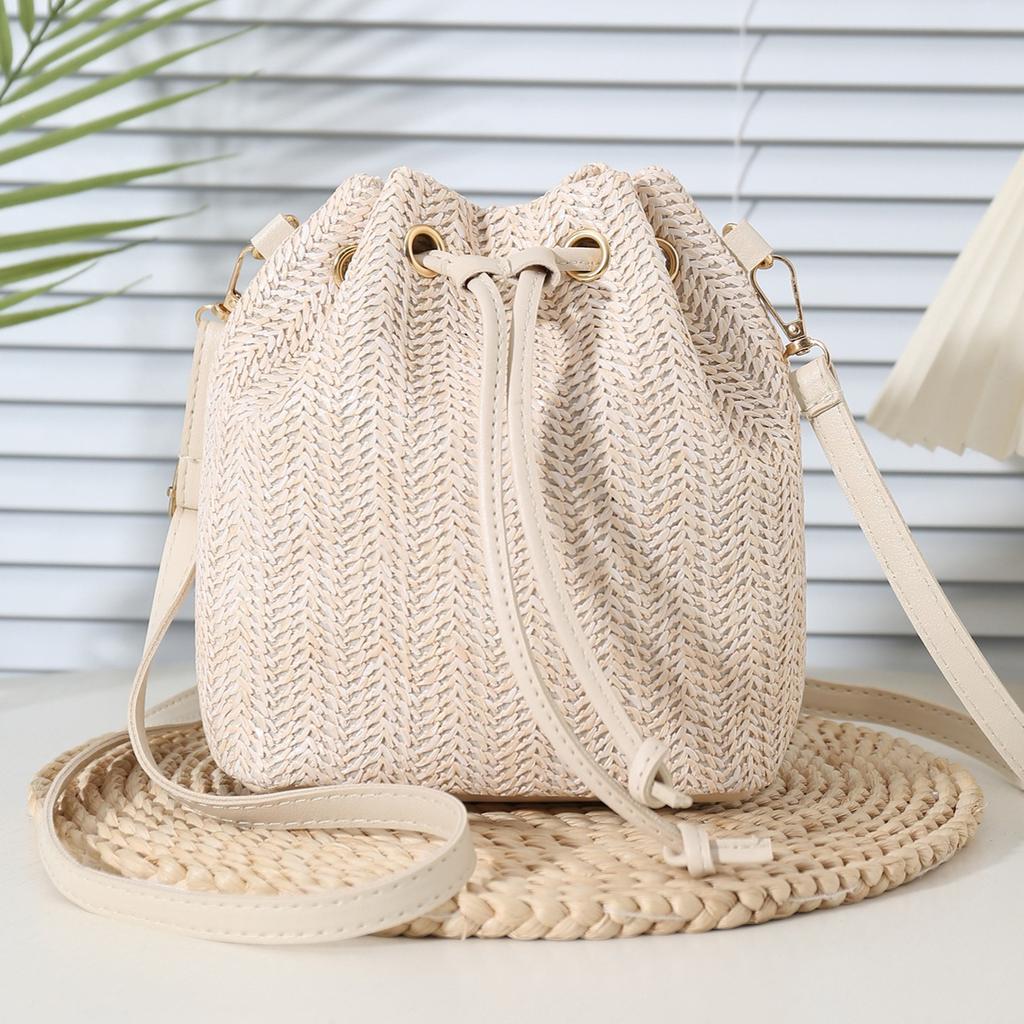 Bohemian Beige Straw Woven Bucket Crossbody Bag with Drawstring Closure Adjustable Leather Strap, Ideal for Beach Casual Daily