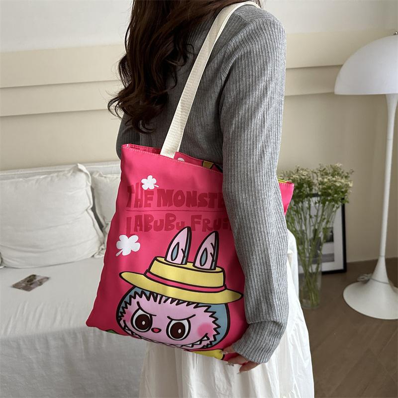 

Large capacity versatile canvas bag female cute cartoon shopping bag high value student handheld tutoring bag average size