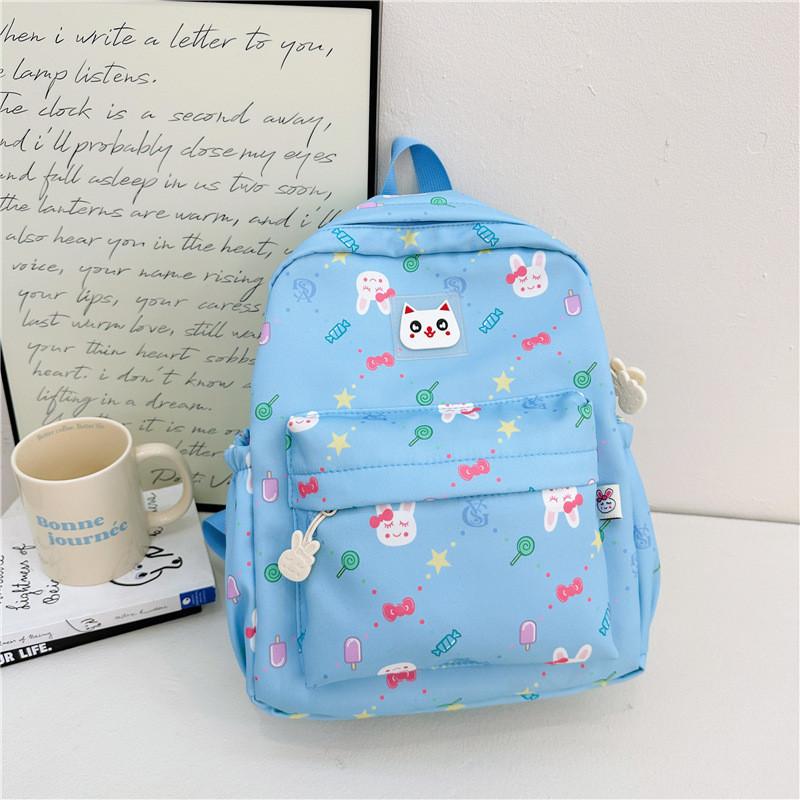 

Cute Cartoon Children s Backpack Stylish Nylon Preschool Bag For Kids With Comfort Straps In Purple Black Green Pink Blue синій