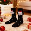 A pair of socks Fabric Christmas Socks - 3D Eyes Magnetic Cartoon Design, Hand-in-Hand Mid-Calf Playful Holiday Gift