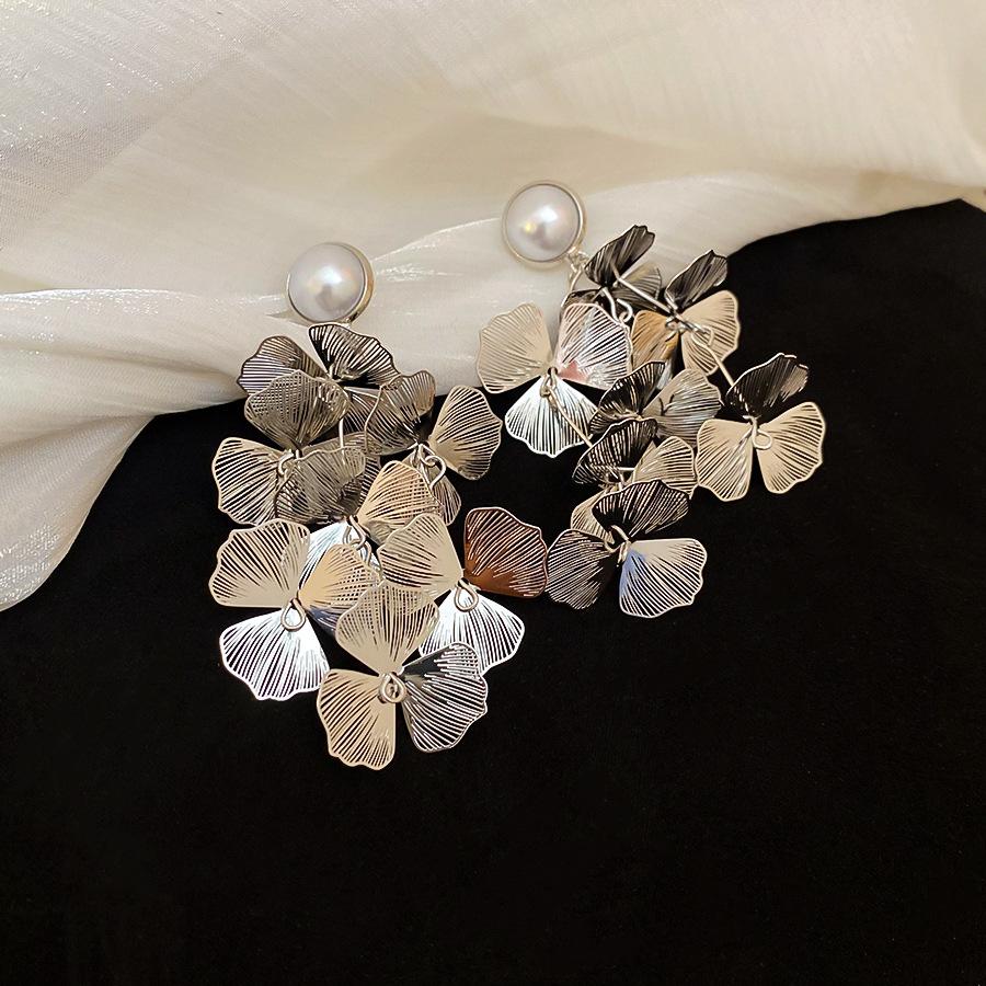 Metal hollow flower fringed stud earrings light luxury temperament earrings European and American exaggerated earrings women