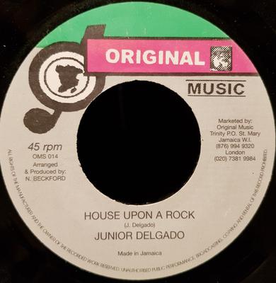 7-Zoll-Schallplatte JUNIOR DELGADO House Upon A Rock OMS14 Originalmusik UK Reggae Ska Dub Gebraucht