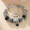 Bracciale con Ciondolo a Forma di Cuore con Strass Neri e Perline Ceramiche di Ciliegio