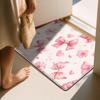 Pink ribbon, floral, and heart patterned floor mat, machine washable polyester, suitable for bedroom and living room decoration.