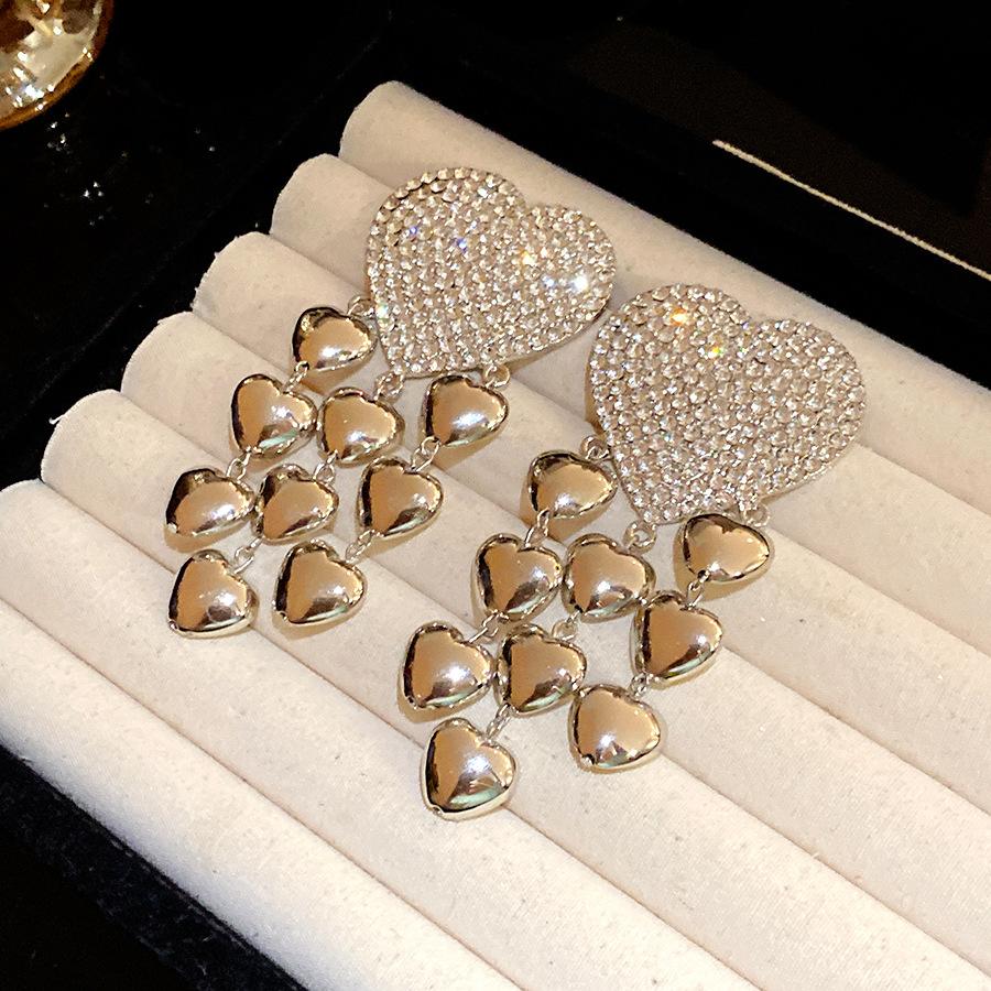 

Silver needle inlaid with diamonds, love fringed earrings, personality exaggerated cold wind temperament earrings, light luxury and high-end earrings