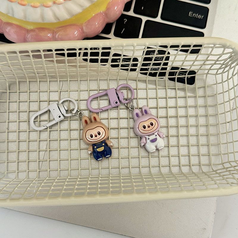 Niedliche Latzhose zum Hochziehen Anhänger Niedlich Cartoon Studenten Tasche Anhänger Geschenk