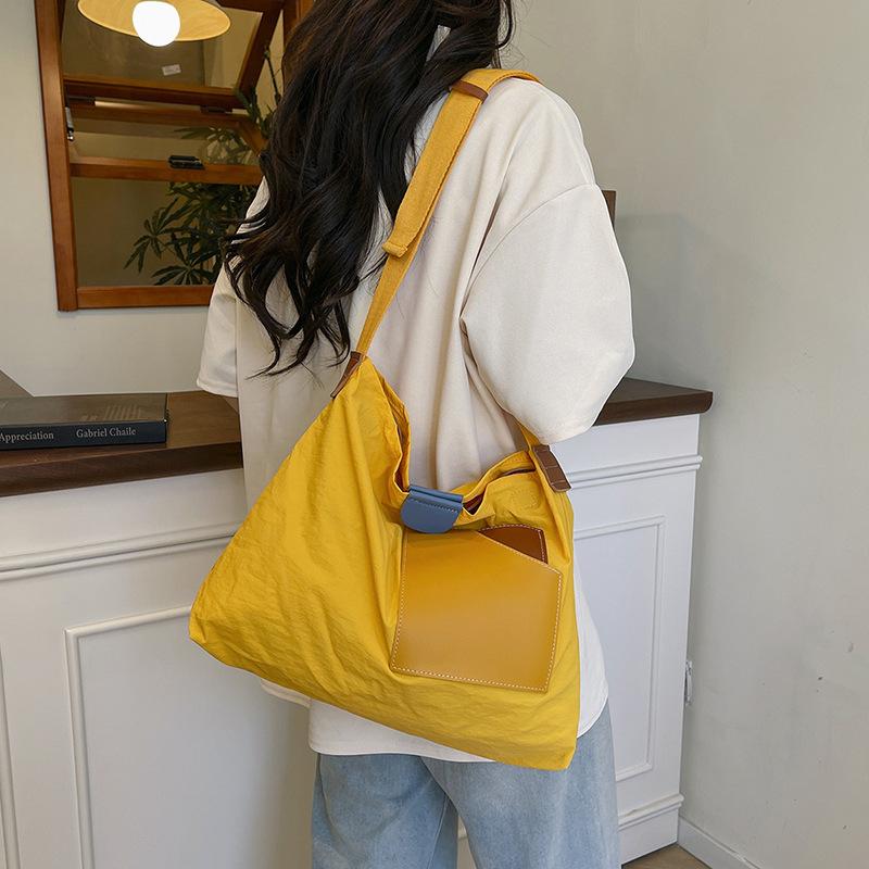 ins niche design splicing canvas bag Korean version women's shoulder bag commuter tote bag versatile casual messenger bag