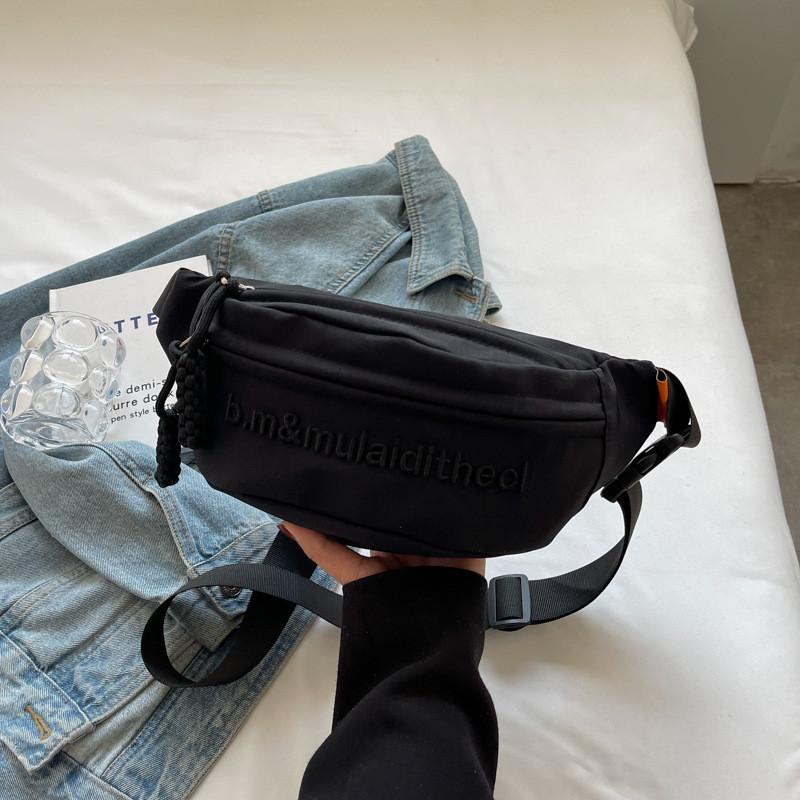Versatile Water-resistant Canvas Crossbody Bag With Letter Print Perfect For Travel And Casual Use