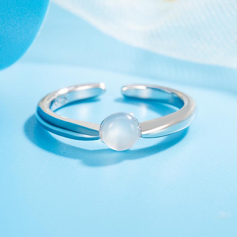 Elegant 2025 Ice-Transparent Egg-Shaped Women's Ring: Versatile, High-End Light Luxury Design with Open Gold Detail.