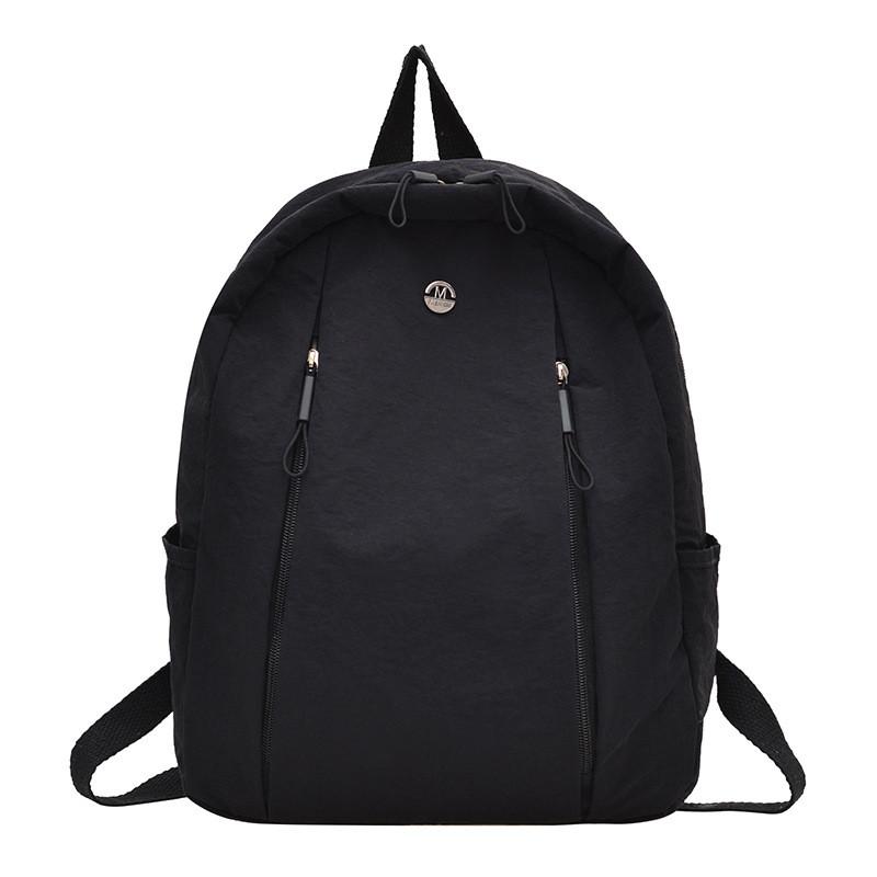 Lightweight Nylon Backpack For Commuting And Travel Withsmall Golden Roundel Decoration