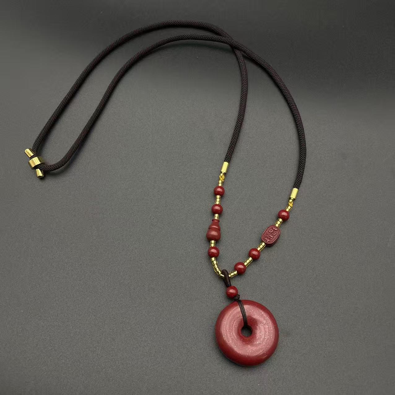 Cinnabar Peace Buckle Necklace with Purple Gold Sand Pendant