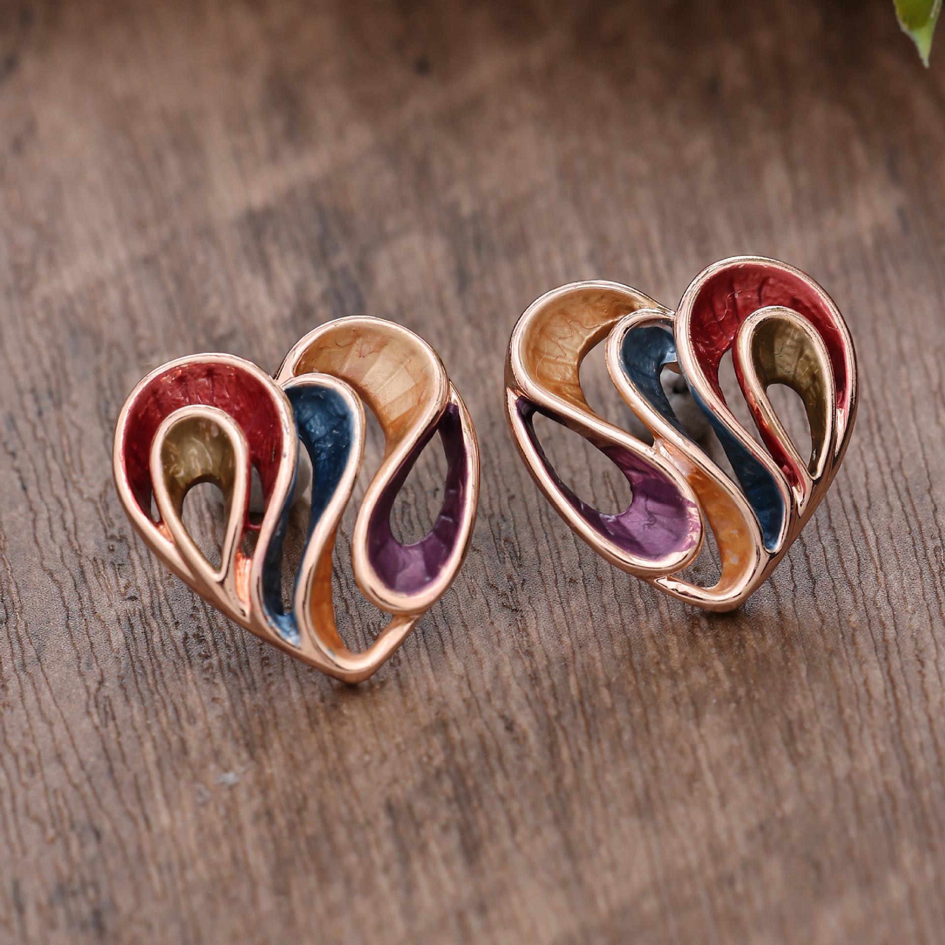 

Новые серьги-пусеты с полым сердечком, расписанные масляной краской, геометричные линии, персонализированные универсальные женские серьги в форме сердца