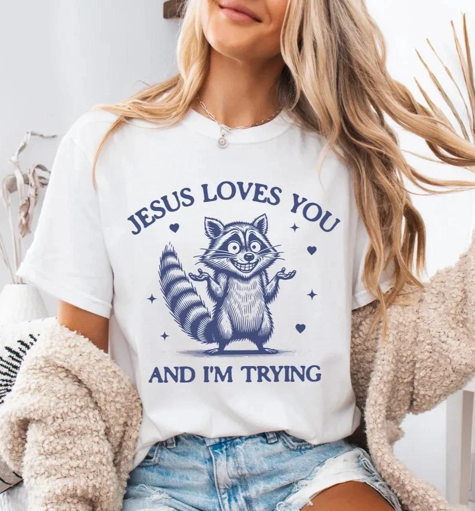 Funny Raccoon Jesus Loves You And Im Trying Graphic Tee Christian Humor T-Shirt S