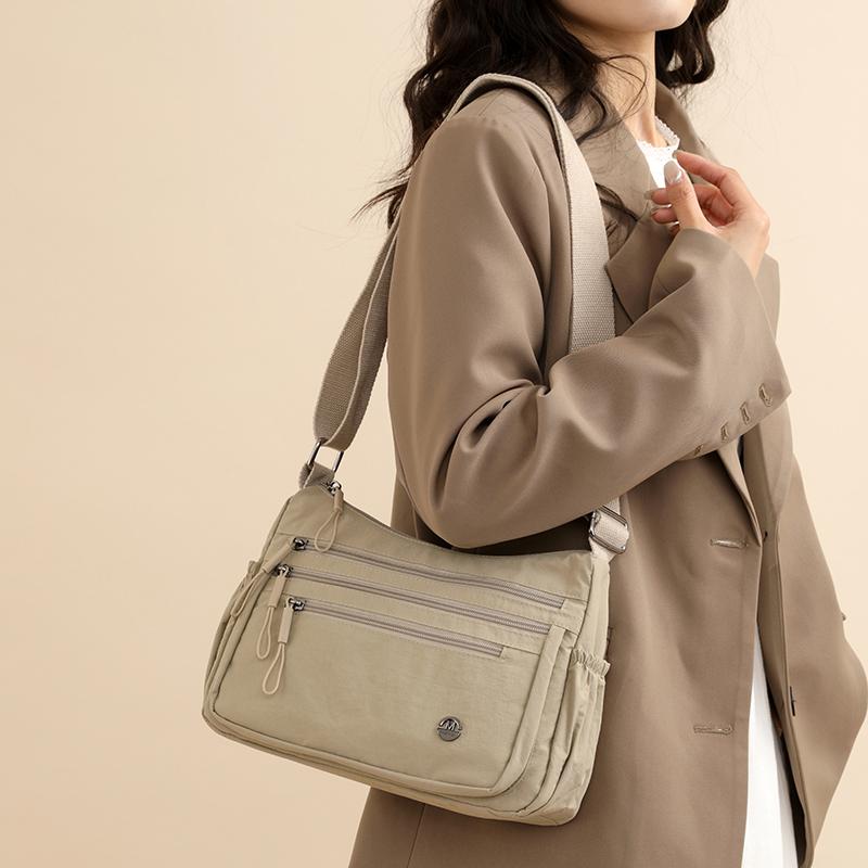 Dameskulderveske med stor kapasitet og lett vekt