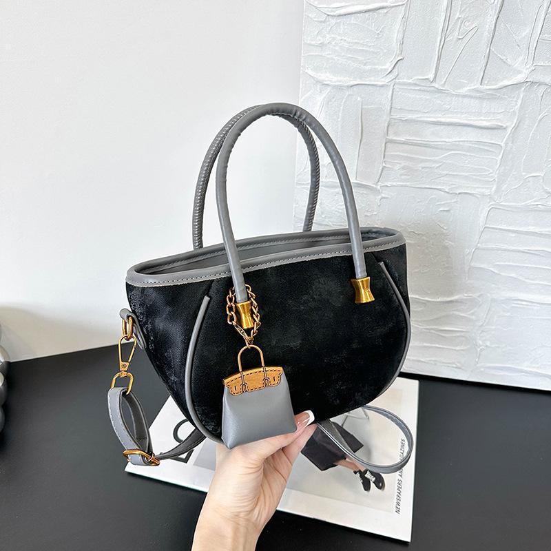Niche design retro handbag women's new fashion versatile shoulder messenger bag bucket bag