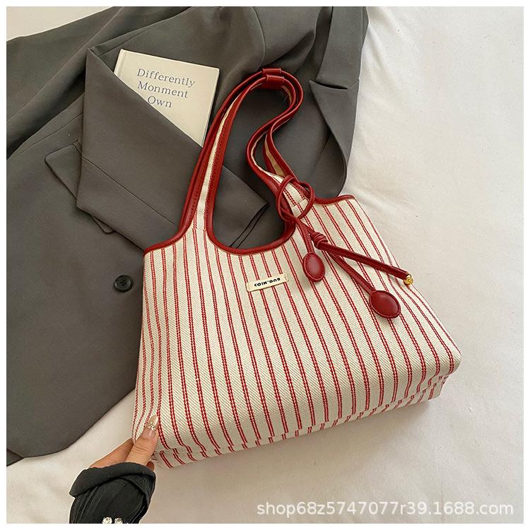 2025 lässige Pendler-Tragetasche Damen Nische gestreift schlicht Mode tragbare Umhängetasche große Kapazität Unterarmtasche