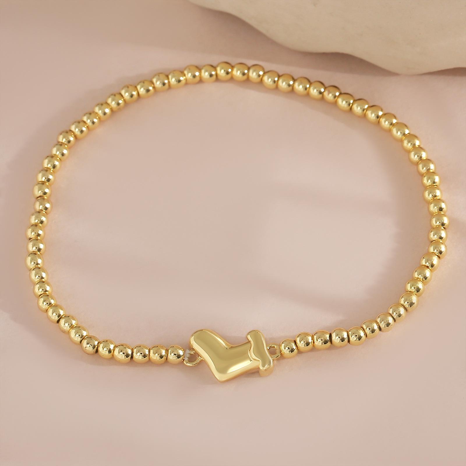 

Gold-Plated Copper Bead Snowman Bracelet: Festive Elastic Accessory